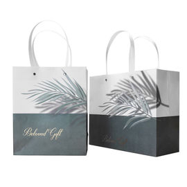 Le cadeau imprimé belle par coutume met en sac le logo adapté aux besoins du client doux avec la poignée plate fournisseur