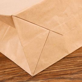 Corde plate favorable à l'environnement de main de sacs en papier de Papier d'emballage imprimée par coutume fournisseur