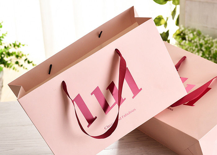 Les sacs à provisions de papier de poignée de ruban avec la colle résistante à la chaleur forte renforcent fournisseur